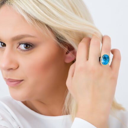 Titanium Ring with Blue Topaz oval with Diamond halo